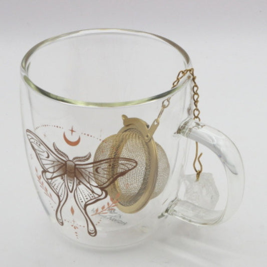 Clear glass mug with butterfly design and tea infuser on a white background