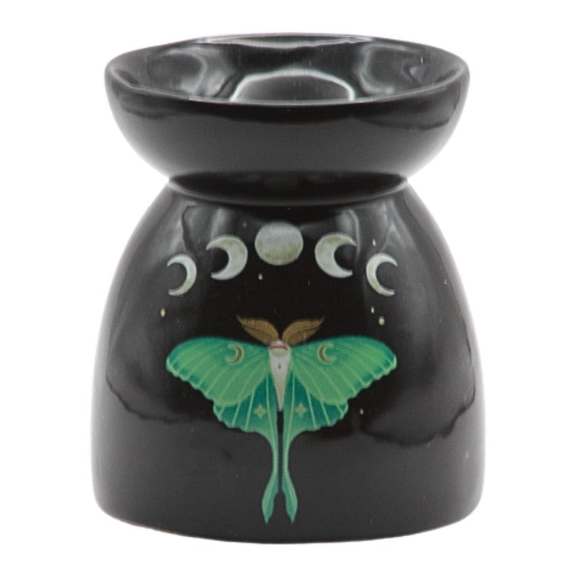 Black oil burner with a green lunar moth and the phases of the moon printed on it