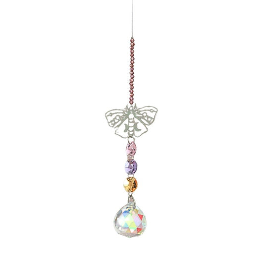 Decorative hanging crystal with colorful beads on a white background