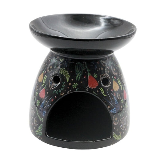 Decorative oil burner with colorful vegetable pattern on a white background