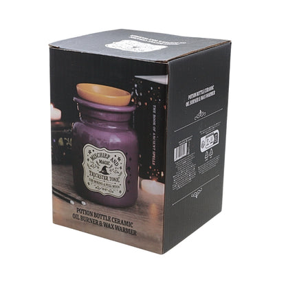 A black cardboard product box for a 'mischief and Magic Potion Bottle Ceramic Oil Burner & Wax Warmer, featuring a purple glass bottle and amber lid printed on the front.