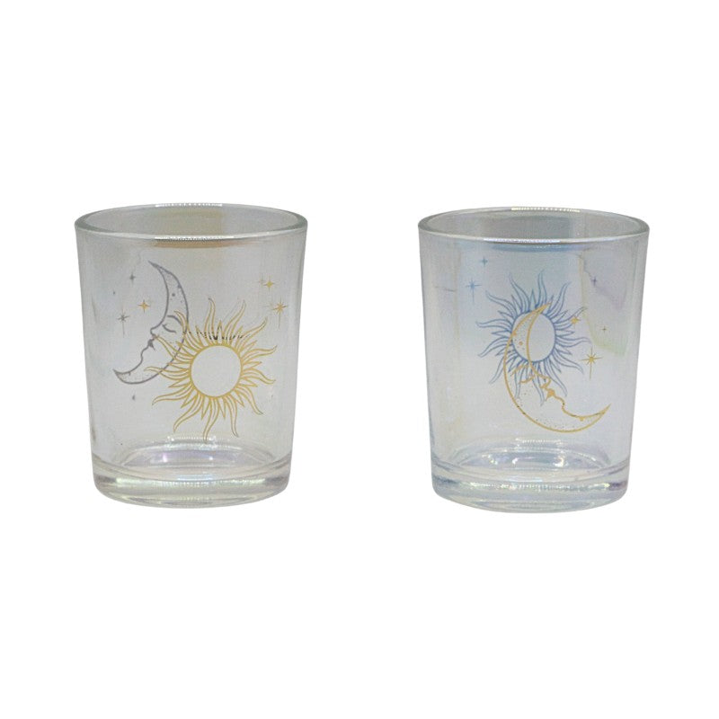 Two glass candle holders with celestial designs on a white background