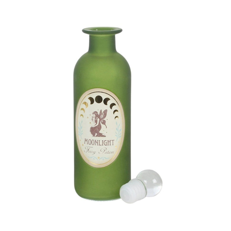 An olive green glass bottle with a white and beige oval label reading 'MOONLIGHT Fairy Potion' and a small fairy illustration, shown with a clear plastic stopper on a white background.