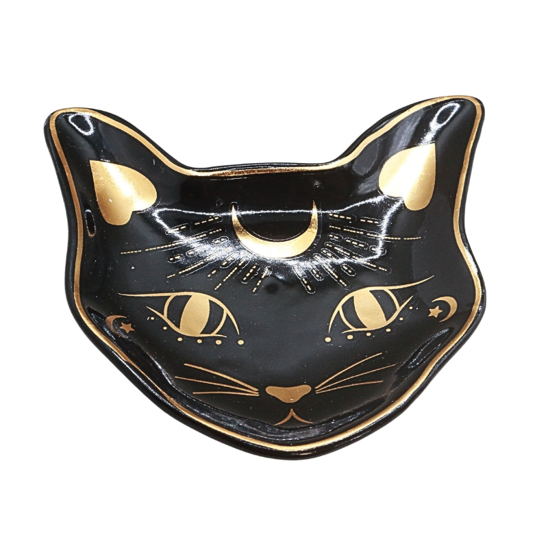 A black cat-shaped ceramic dish with gold painted details, including eyes, whiskers, a crescent moon, and heart-shaped ears, shown on a plain white background.
