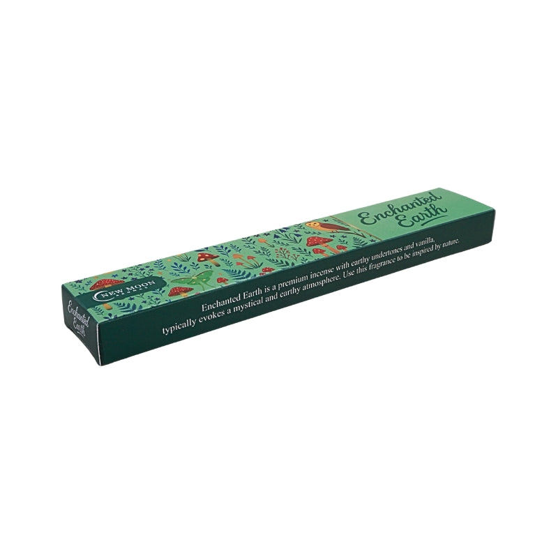 green incense box with mushroom forest design and an owl with the words "enchanted earth", on a white background.