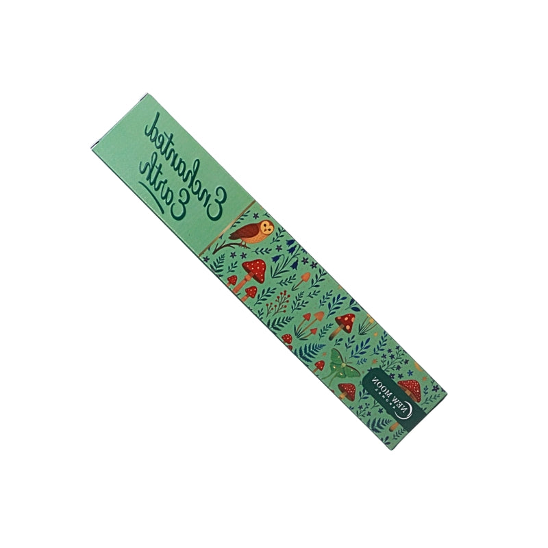 green incense box with mushroom forest design and an owl with the words "enchanted earth", on a white background.