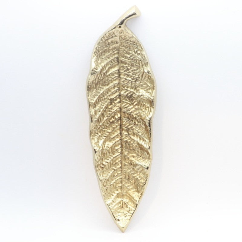 gold incense holder in the shape of a leaf