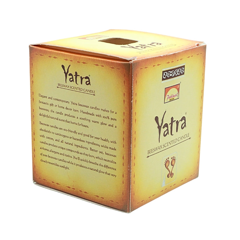 Angled view of the gold Parimal Yatra beeswax candle box showing the branded front and product description panel