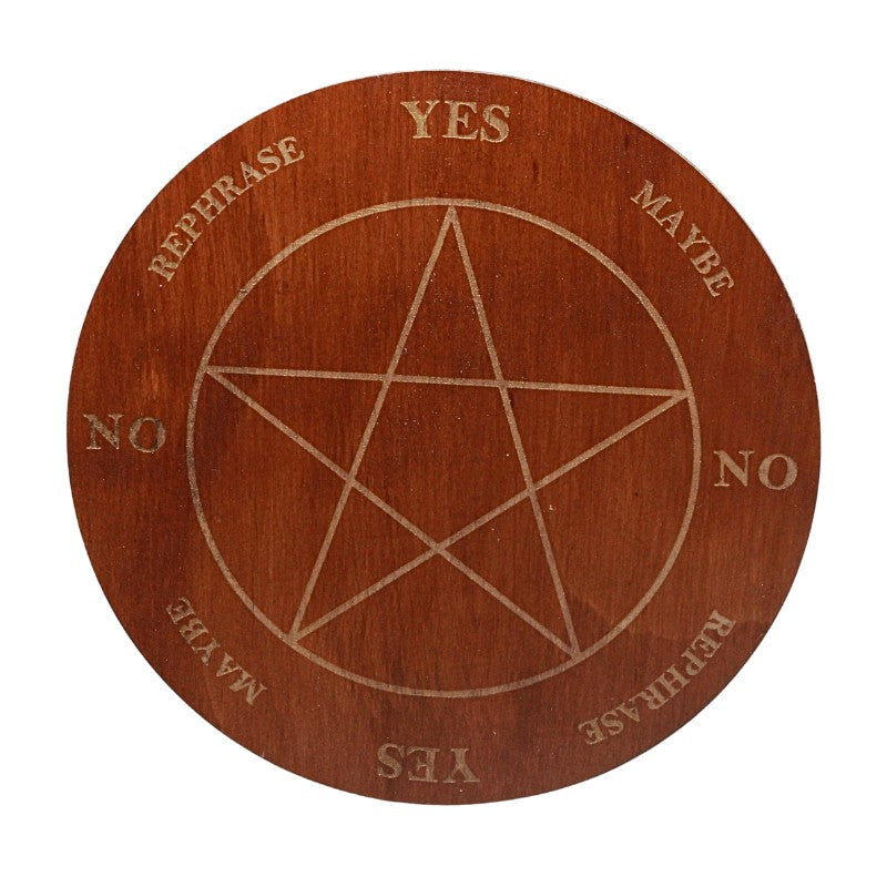 Wooden disc with pentagram design and yes/no choices on a white background