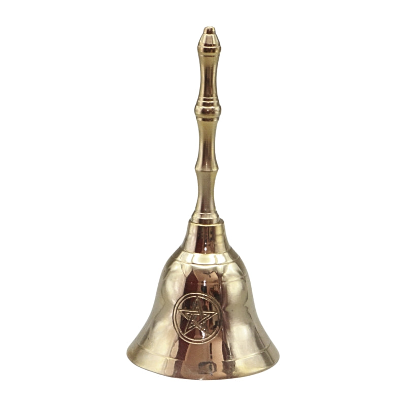 A polished brass bell with a matching handle, featuring an engraved pentagram symbol on the front, set against a plain white background.