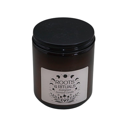 Black candle jar with a label on a white background