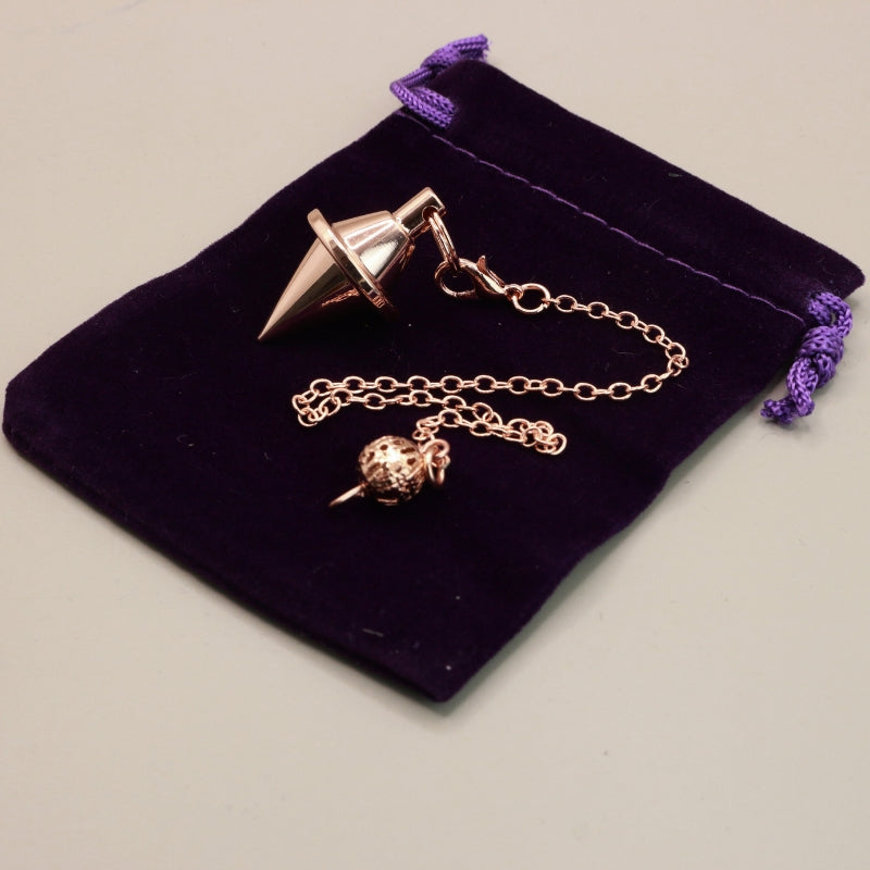 Rose Gold Pendulum On Purple Velvet Bag
