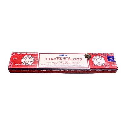 A rectangular box of Nag Champa incense sticks, featuring a red and white design with the scent name 'Dragon's Blood' printed prominently in the center.