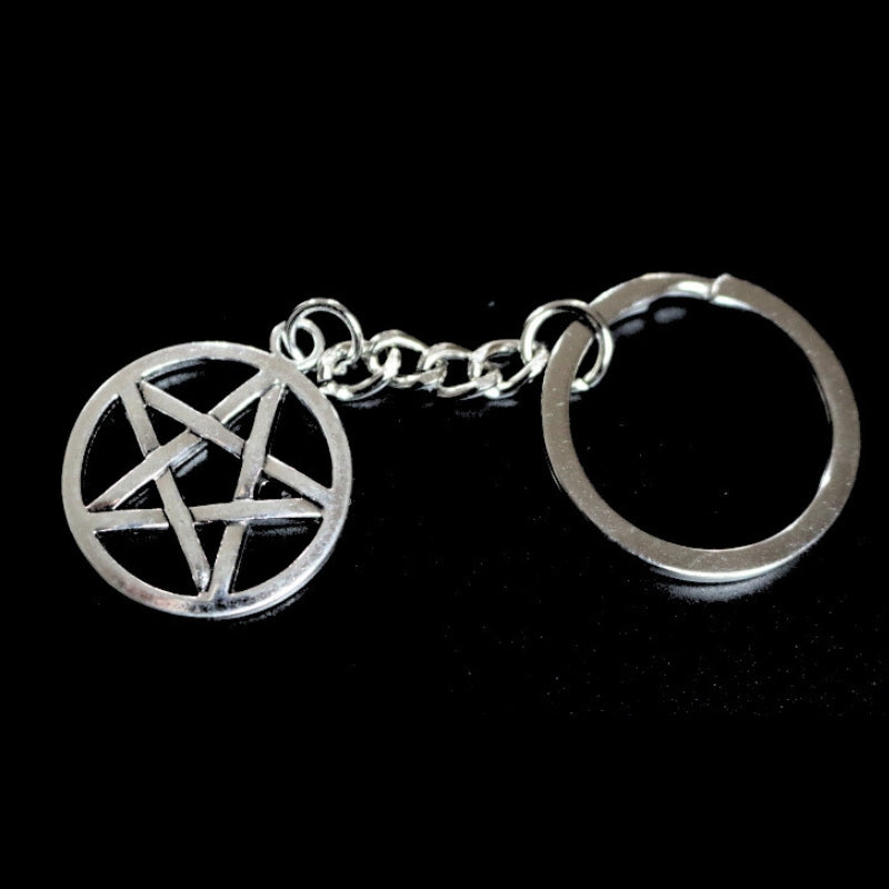 silver coloured key ring with a pentacle (5 pointed star within a circle) joined to a silver ring by a silver chain