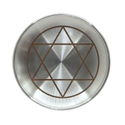 Metallic plate with star of david design on a white background