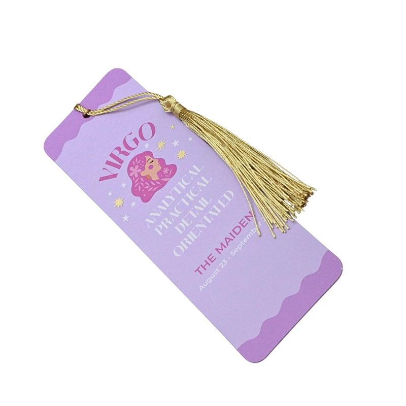 pink and purple bookmark with gold tassel and white and purple writing, on a white background
