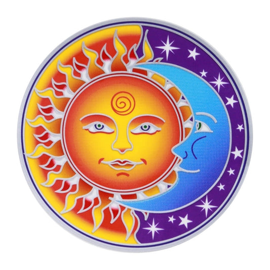 Decorative sticker with sun and moon faces on a circular design with stars.