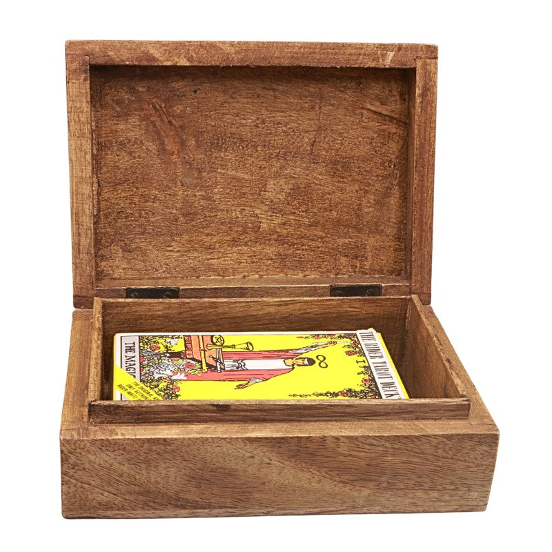 An open rectangular wooden box with a hinged lid, shown on a plain white background. Inside the box is a tarot card deck, with the 'Magician' card visible on the bottom shelf.
