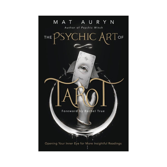black book cover featuring a hand holding a tarot card and the title "The Psychic Art of Tarot" with the name "Mat Auryn"