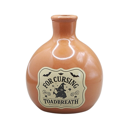 orange coloured ceramic bottle with a tapered neck and old style vintage label that reads "for cursing toadbreath"