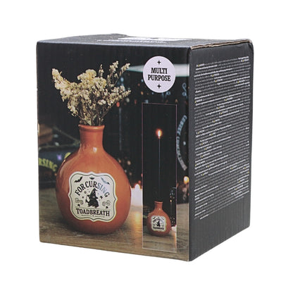 square box packaging for an orange coloured ceramic bottle with a tapered neck and old style vintage label that reads "for cursing toadbreath"