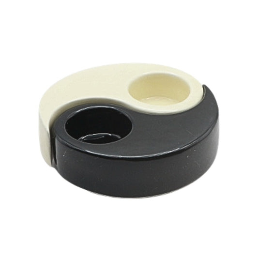 Black and beige yin yang candle holder on a white background