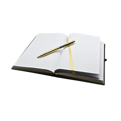 Open notebook with a pen on a white background