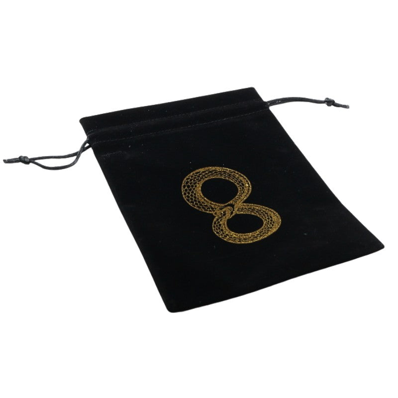 black velvet tarot bag with gold ouroboros symbol on front