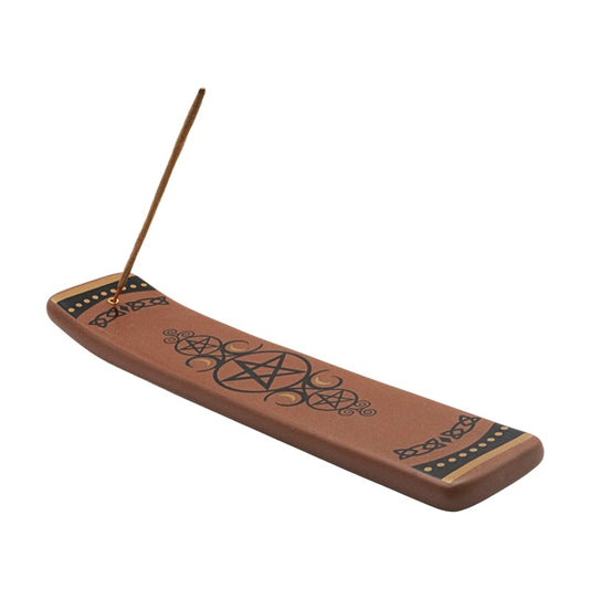 Ceramic incense burner with pentagram design on a white background