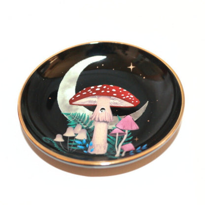 black incense dish with mushrooms, ferns and a crescent moon. 