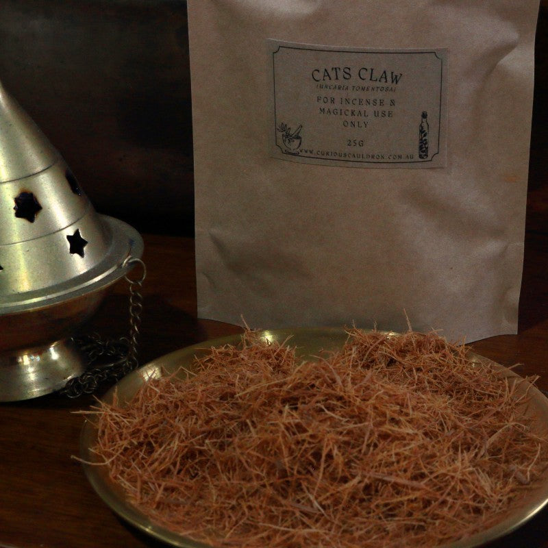 Cats Claw on a metal tray with a labeled bag in the background