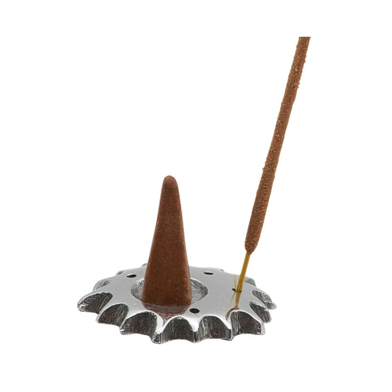 Incense cone and stick on a metal incense holder against a white background