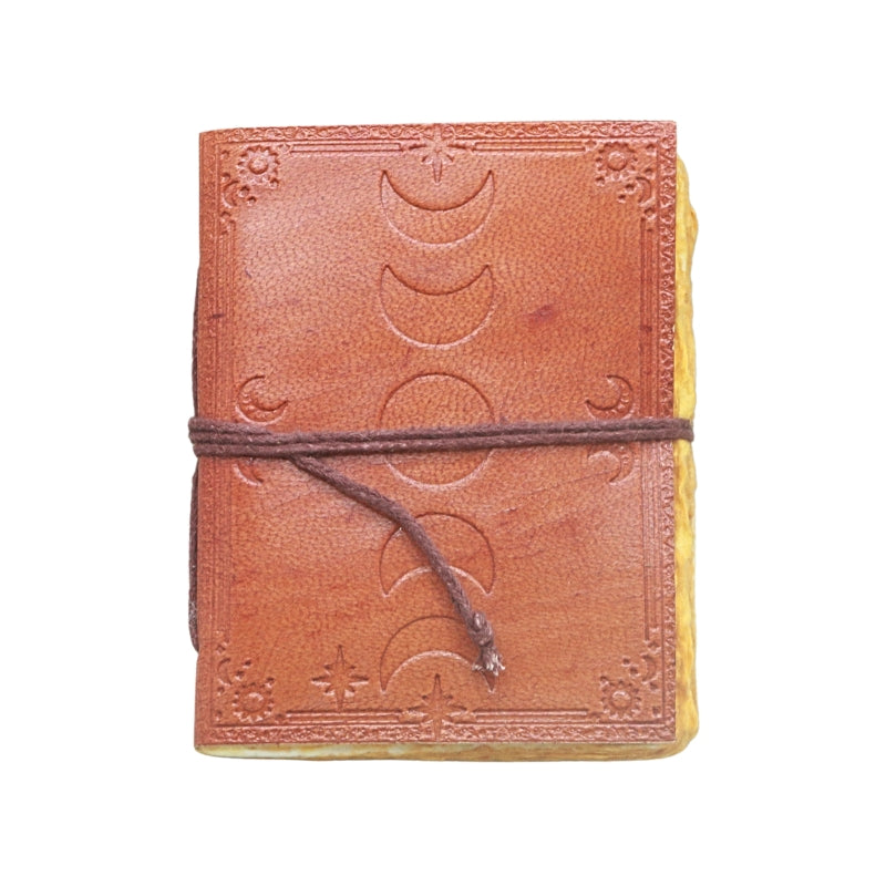 brown leather journal, embossed with image of the moon phases, with a brown tie, on a white background