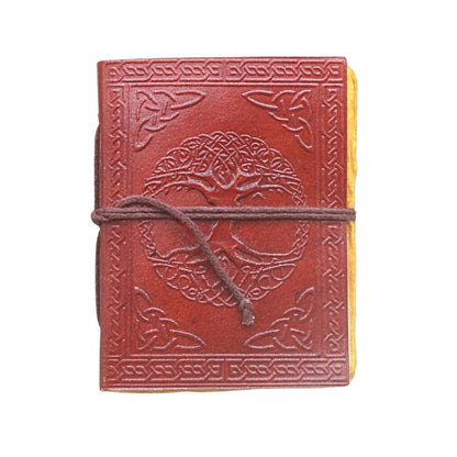 brown leather journal, embossed with image of a tree and celtic knots, with a brown tie, on a white background