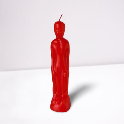 red naked figure candle in the shape of a naked male- front view- on a white background