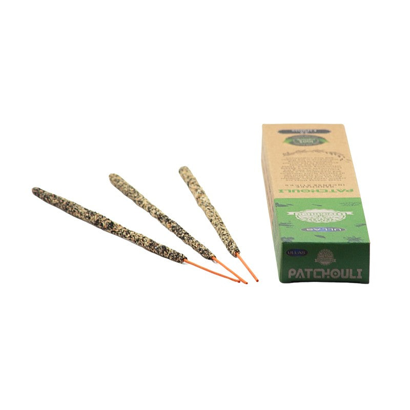 recycled cardboard box pack of incense next to 3 handmade incense sticks