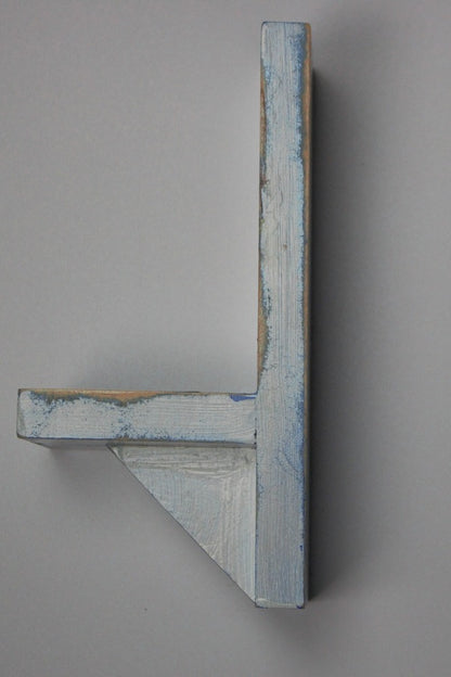 distressed blue and white wooden wall mounted candle or ornament shelf  side view